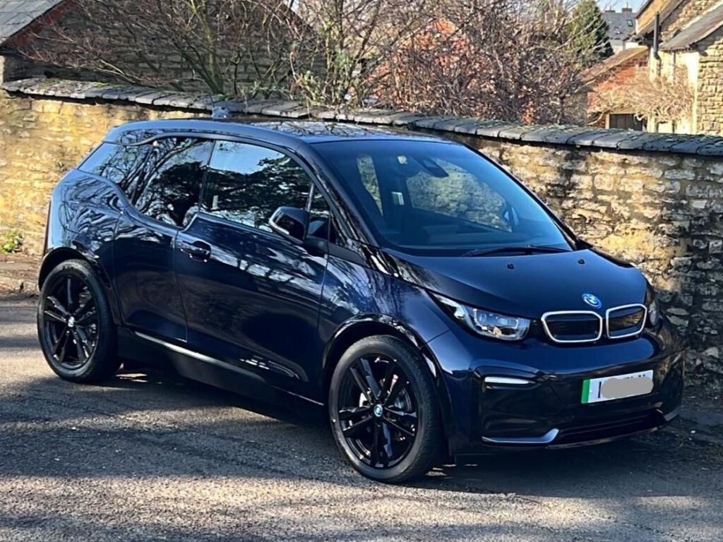 Steve J's BMW i3S 2022 parked by a wall.