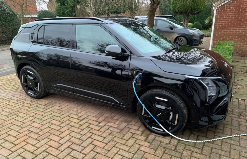 Kia EV3 charging at home on driveway