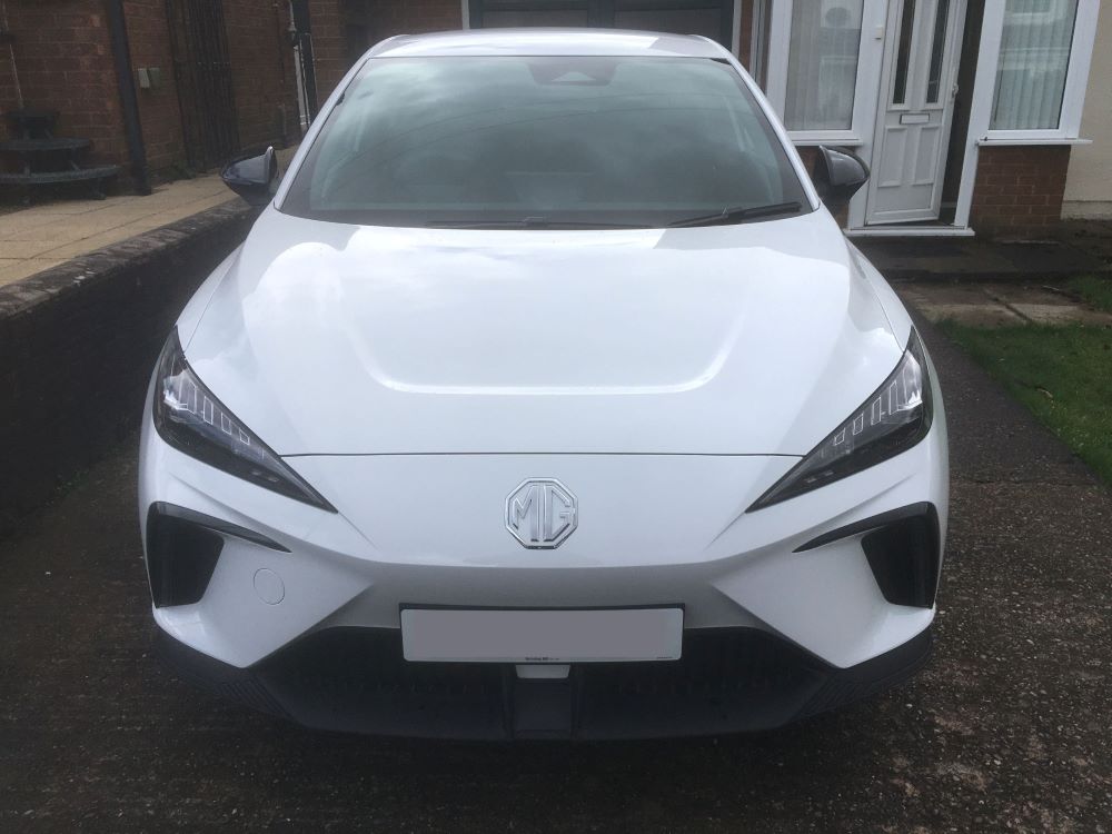 MG4 EV white parked on owner's driveway