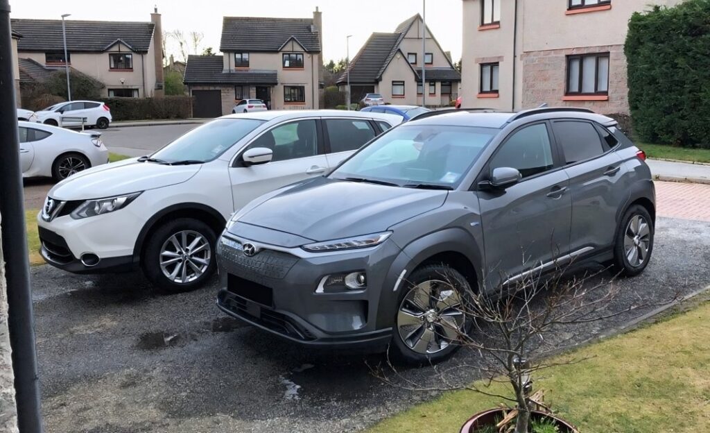 Colin Gray's 2019 Hyundai Kona Electric 64kWh parked up on his driveway next to a Nissan Qashqai