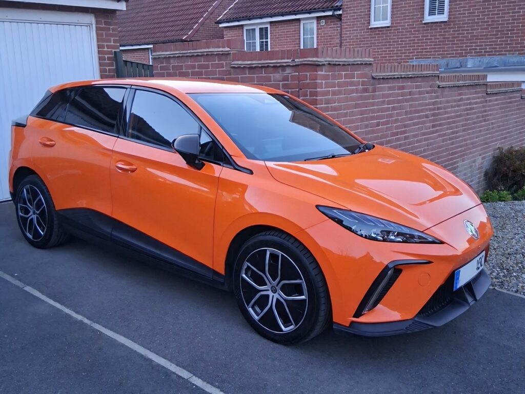 Neil's MG4 EV parked on his driveway in front of his garage
