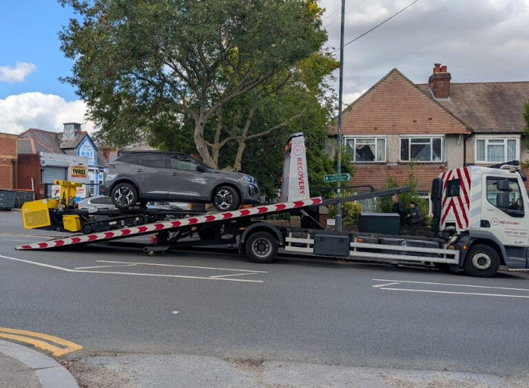 My Peugeot EV Experience's Peugeot E-2008 GT 50kWh 2023 on the back of a recovery lorry